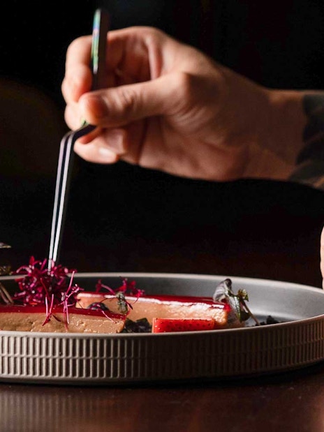 Dining experience at CÉ LA VI Dubai with gourmet dish preparation.