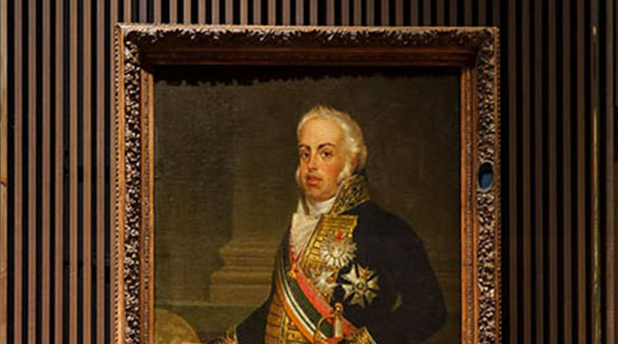 Portrait of a historical figure with a crown on display at the Royal Treasure Museum.