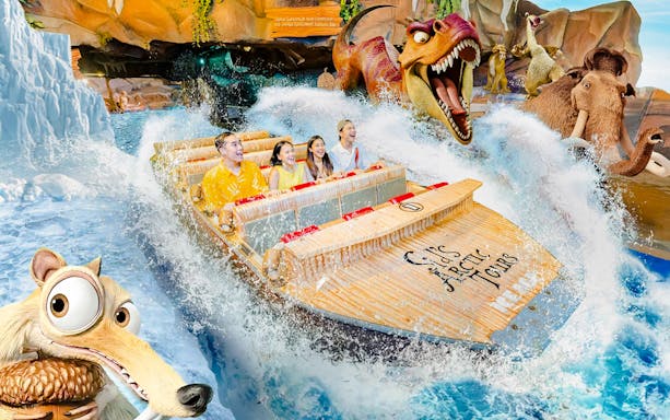Visitors enjoying a water ride with animated characters at Dunia Fantasi Dufan Theme Park.
