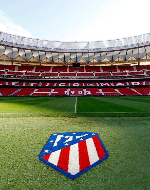 Civitas Metropolitano Stadium field view, Madrid, with Atlético de Madrid logo.