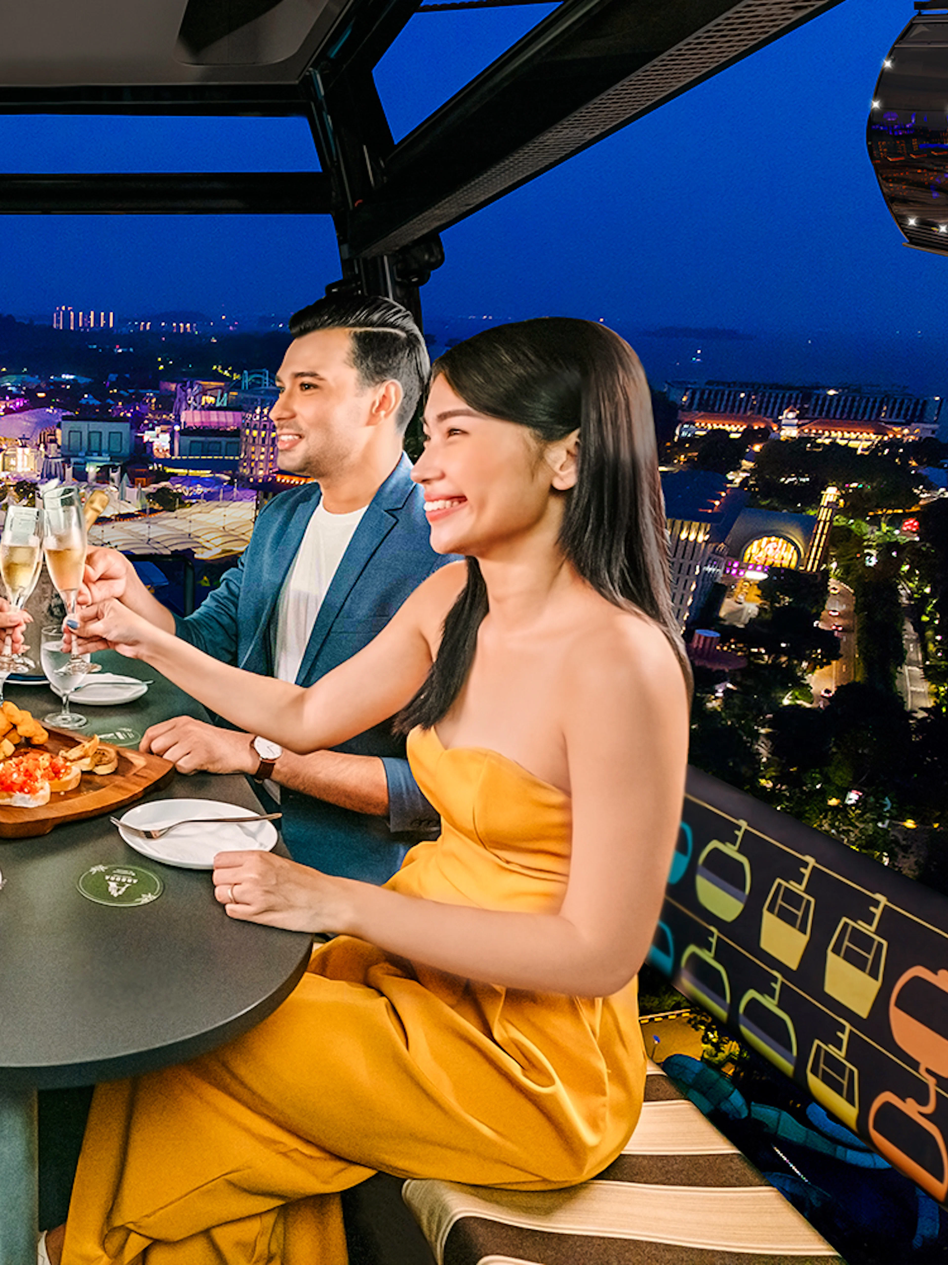 Four guests enjoying a meal in a Singapore cable car with city lights in the background.
