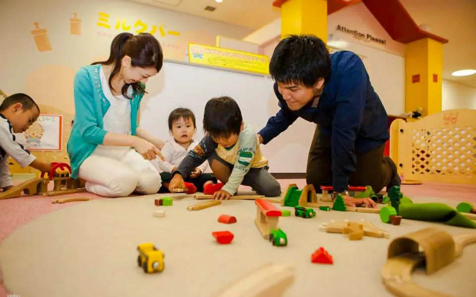 Children playing with toy trains at Kids Plaza Osaka.