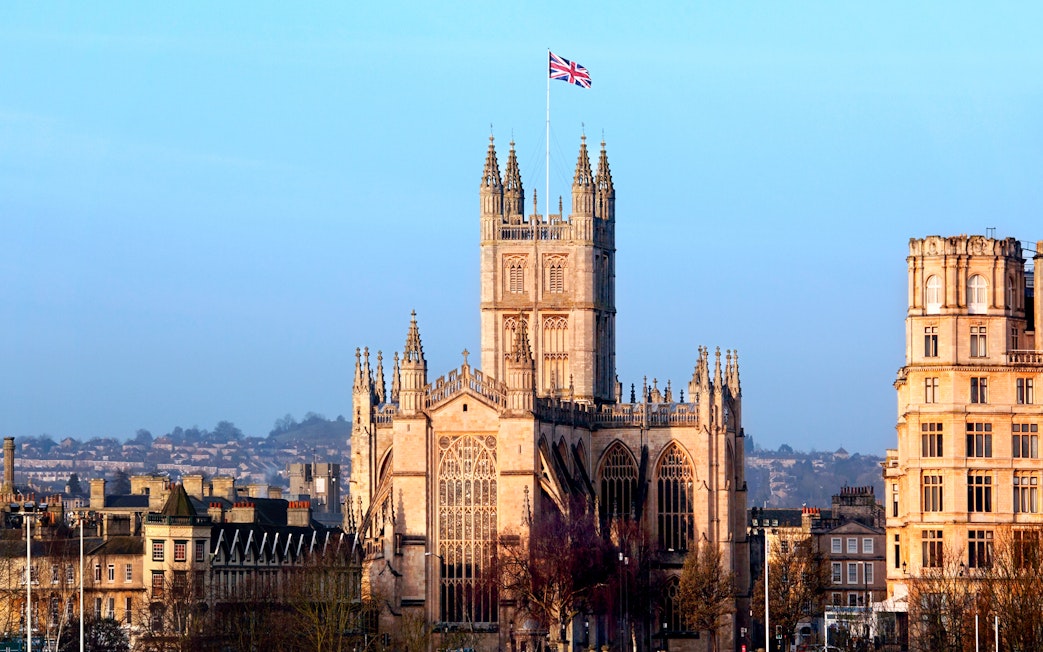 Bath Abbey with Union Jack flag, Bath, England.