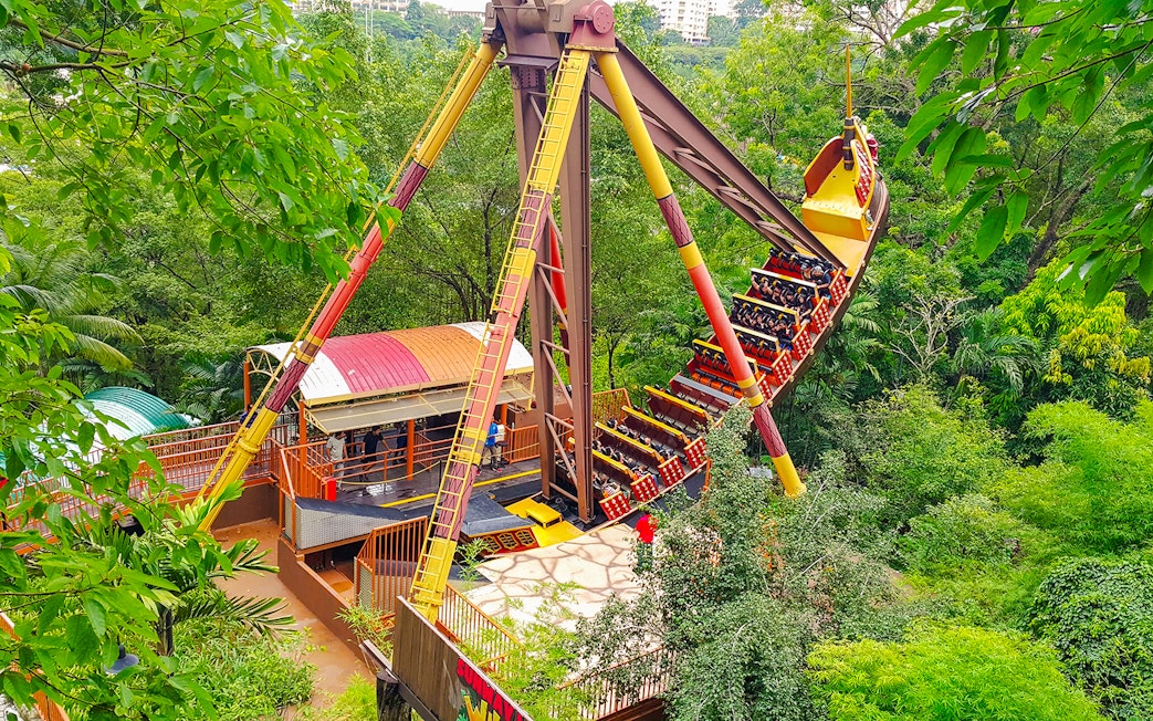 Sunway Lagoon amusement park ride surrounded by lush greenery.