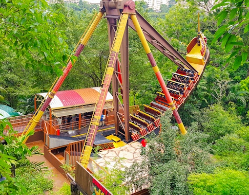 Sunway Lagoon amusement park ride surrounded by lush greenery.