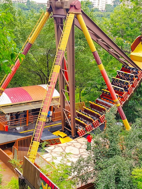 Sunway Lagoon amusement park ride surrounded by lush greenery.