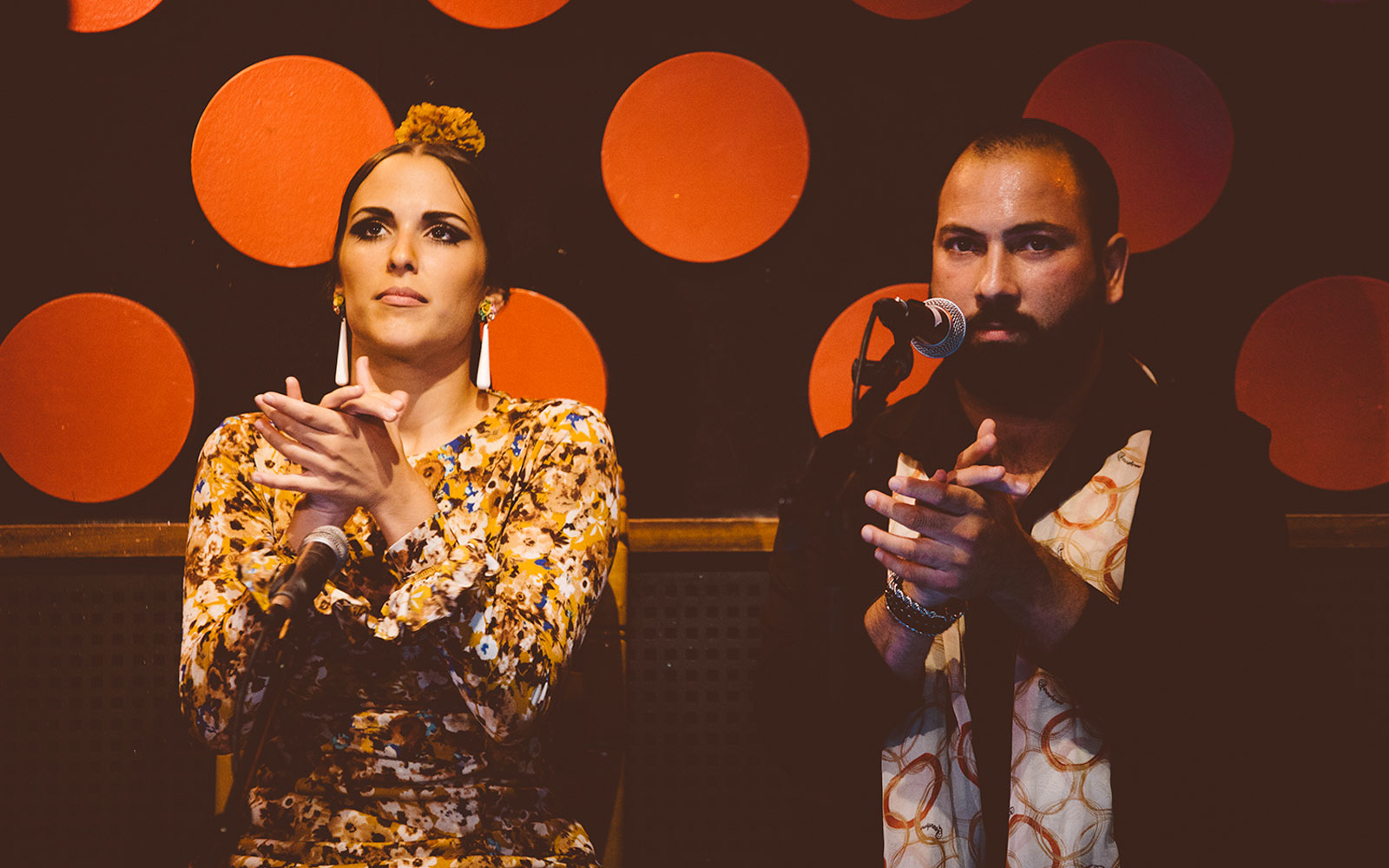 Flamenco artists clapping rhythmically at Los Tarantos Flamenco Show.
