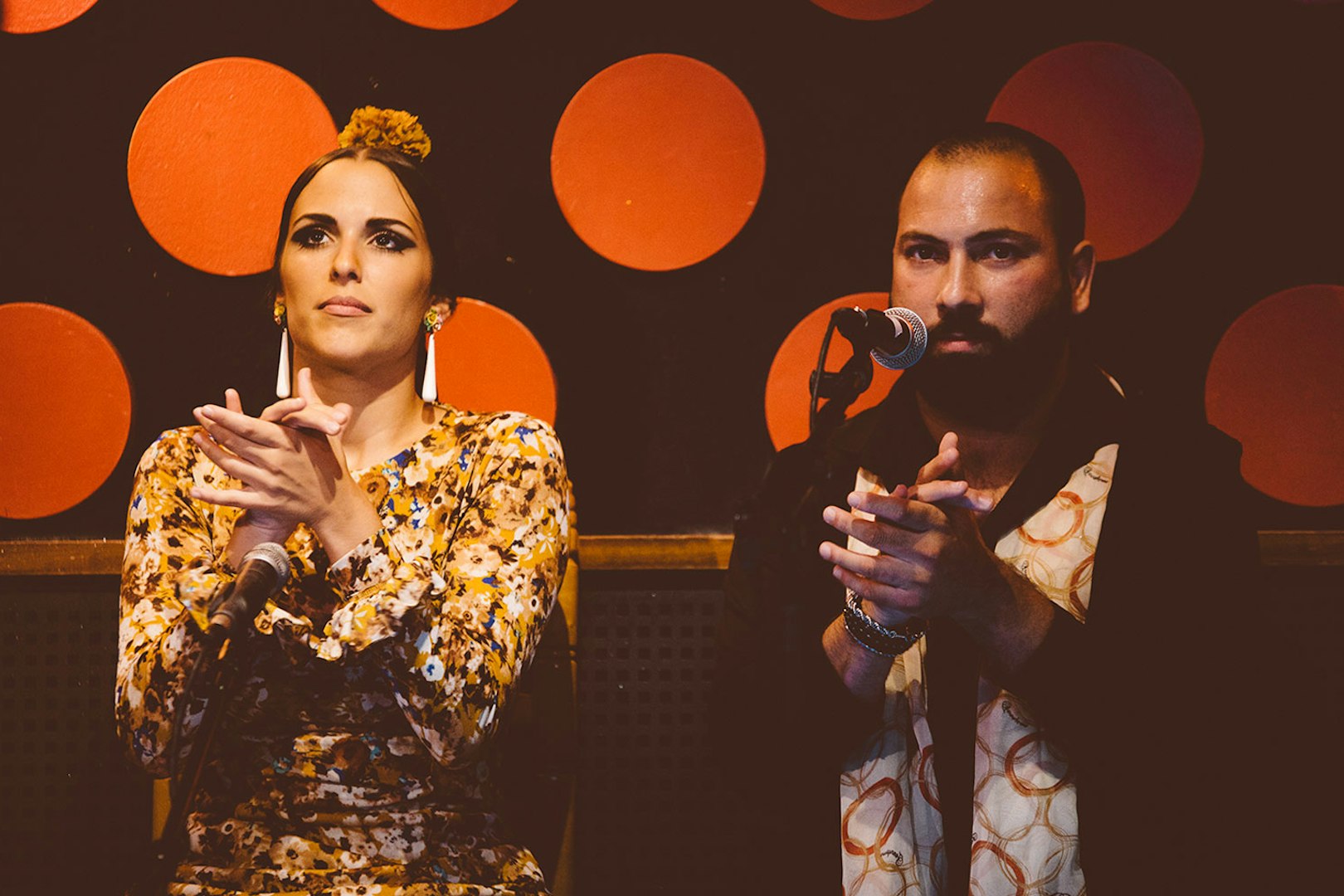 Flamenco artists clapping rhythmically at Los Tarantos Flamenco Show.