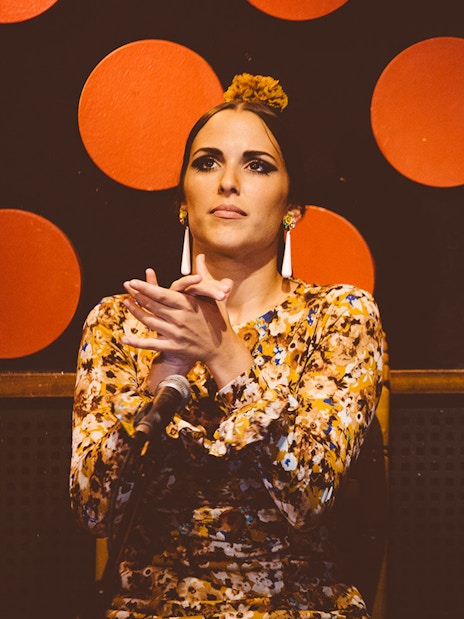 Flamenco artists clapping rhythmically at Los Tarantos Flamenco Show.