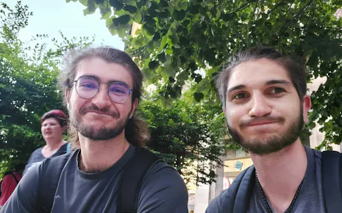 Two people smiling in Budapest's Jewish Quarter during a self-guided city exploration game.