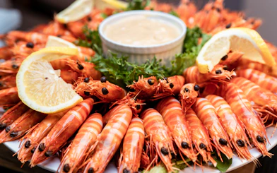 Prawns with lemon wedges and sauce on Darwin Harbour Sunset Dinner Cruise.