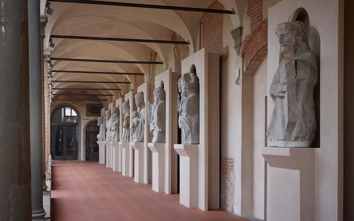 Cloister courtyard with statues in Opera Del Duomo Museum, Florence.