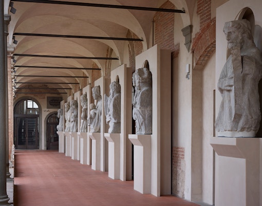 Cloister courtyard with statues in Opera Del Duomo Museum, Florence.