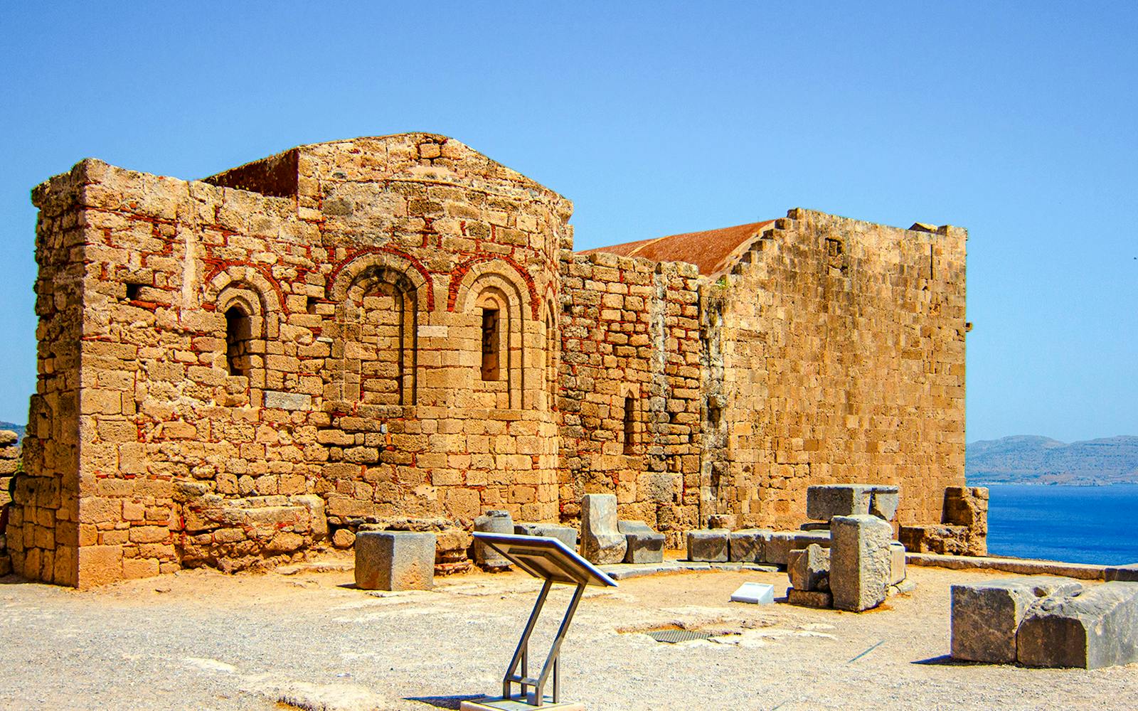 Ruins of Byzantine church of St. John at Acropolis of Lindos with sea view.