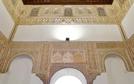 Ornate architectural details inside the Royal Alcázares of Seville.