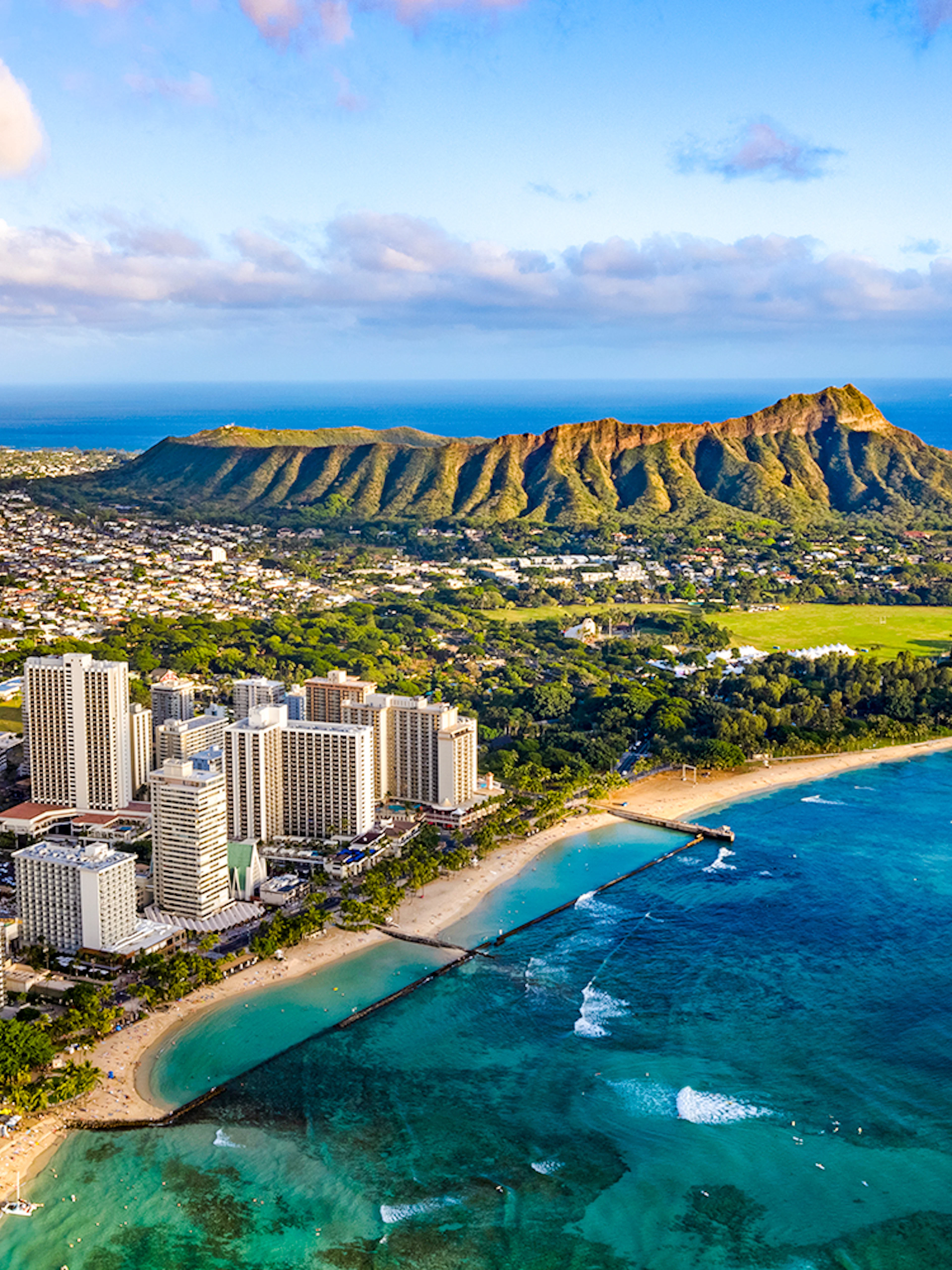 Waikiki skyline with Queen Kapiolani Park, Kuhio Beach, and Diamond Head in the background.
