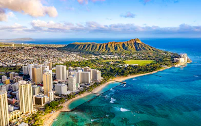 Waikiki skyline with Queen Kapiolani Park, Kuhio Beach, and Diamond Head in the background.