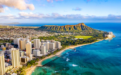 Waikiki skyline with Queen Kapiolani Park, Kuhio Beach, and Diamond Head in the background.