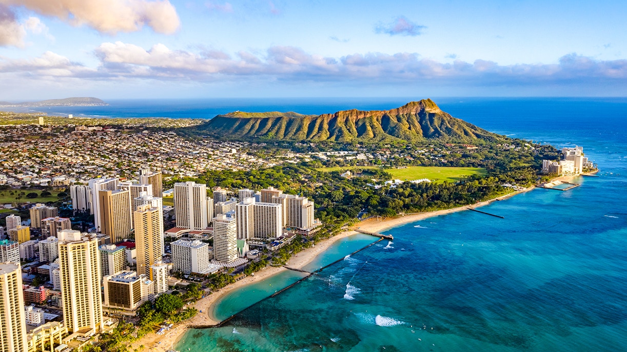 Waikiki skyline with Queen Kapiolani Park, Kuhio Beach, and Diamond Head in the background.