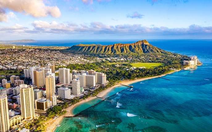 Waikiki skyline with Queen Kapiolani Park, Kuhio Beach, and Diamond Head in the background.