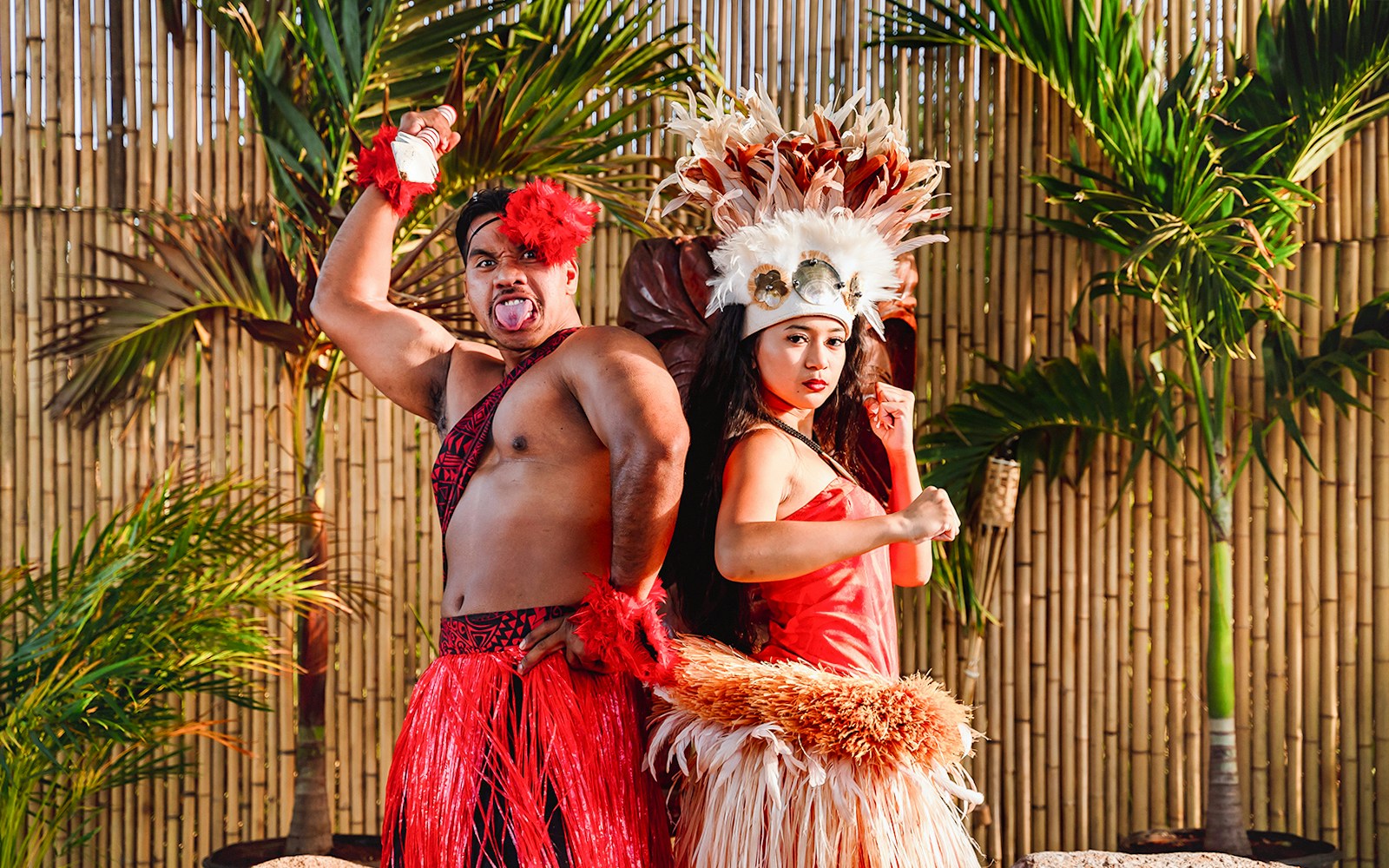 Performers in traditional attire posing before a cultural show at Mauka Warriors Luau, Hawaii.