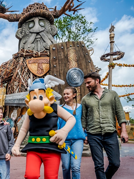 Characters from Parc Asterix in France entertaining tourists during a live show.
