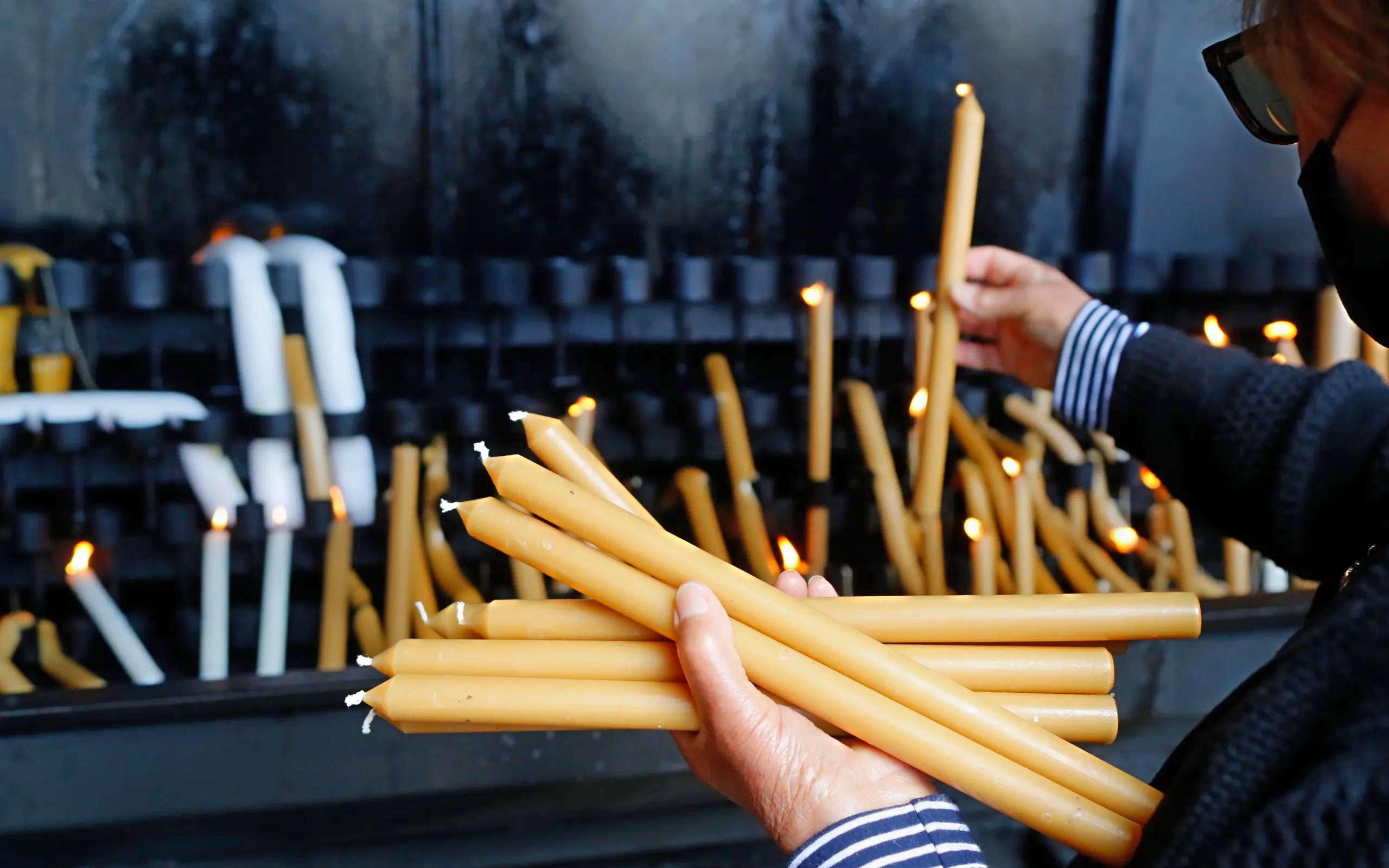 Lighting candles at a shrine in Fatima, Portugal.