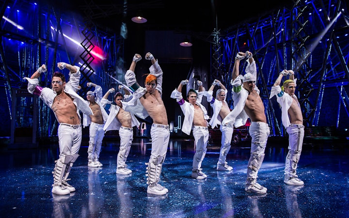 Performers in white costumes dancing at Michael Jackson ONE show.