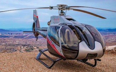 Helicopter on a landing spot overlooking Las Vegas and Red Rock Canyon.