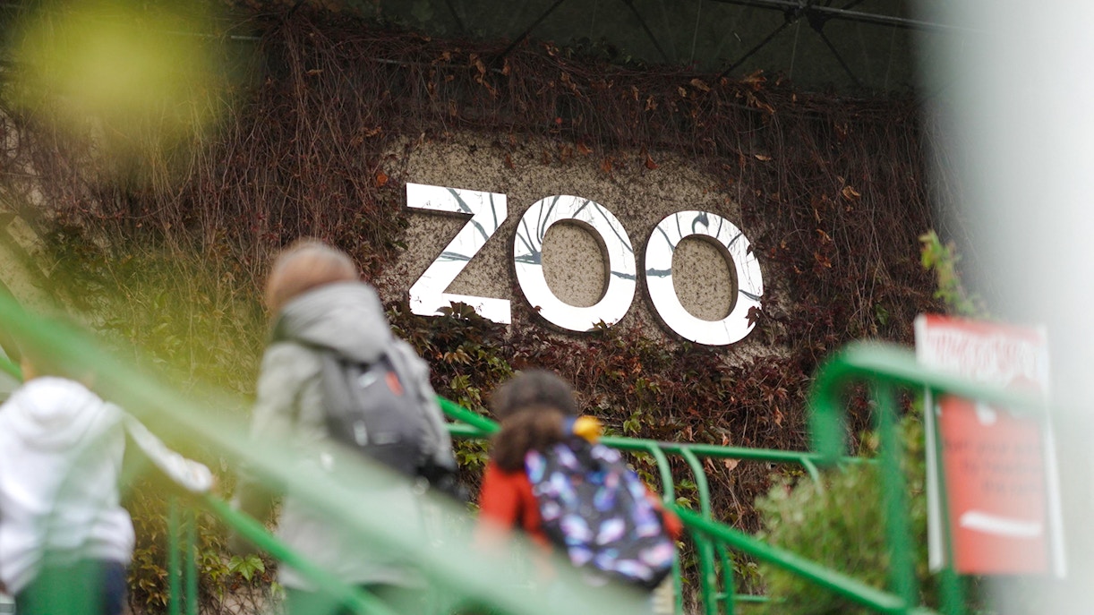 Zoo entrance sign at Edinburgh Zoo with animal illustrations.