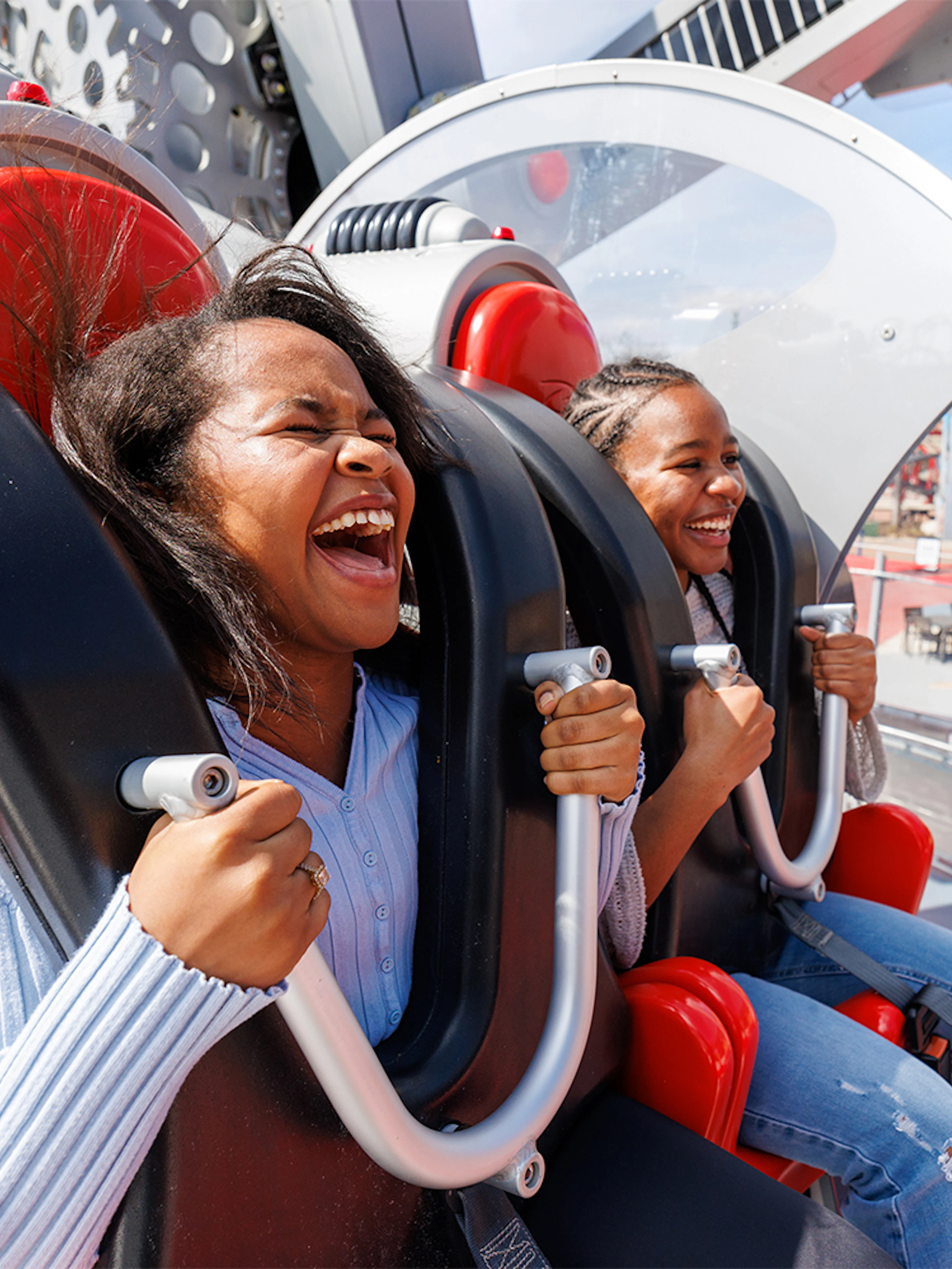Visitors enjoying CYBORG™ Cyber Revolution ride at Six Flags Fiesta Texas.