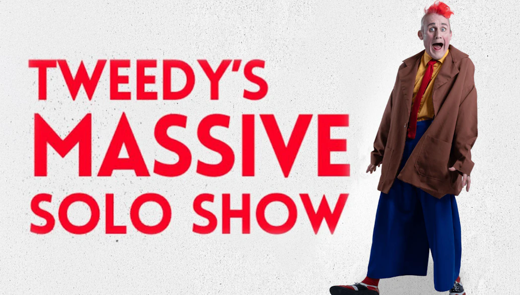 Tweedy in oversized clothing promoting his Massive Solo Show.