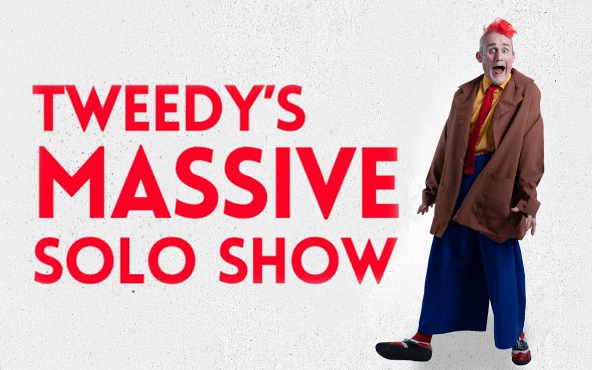 Tweedy in oversized clothing promoting his Massive Solo Show.