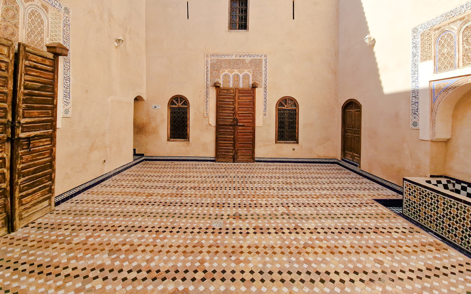 Bahia Palace courtyard with intricate tilework in Marrakech, Morocco.