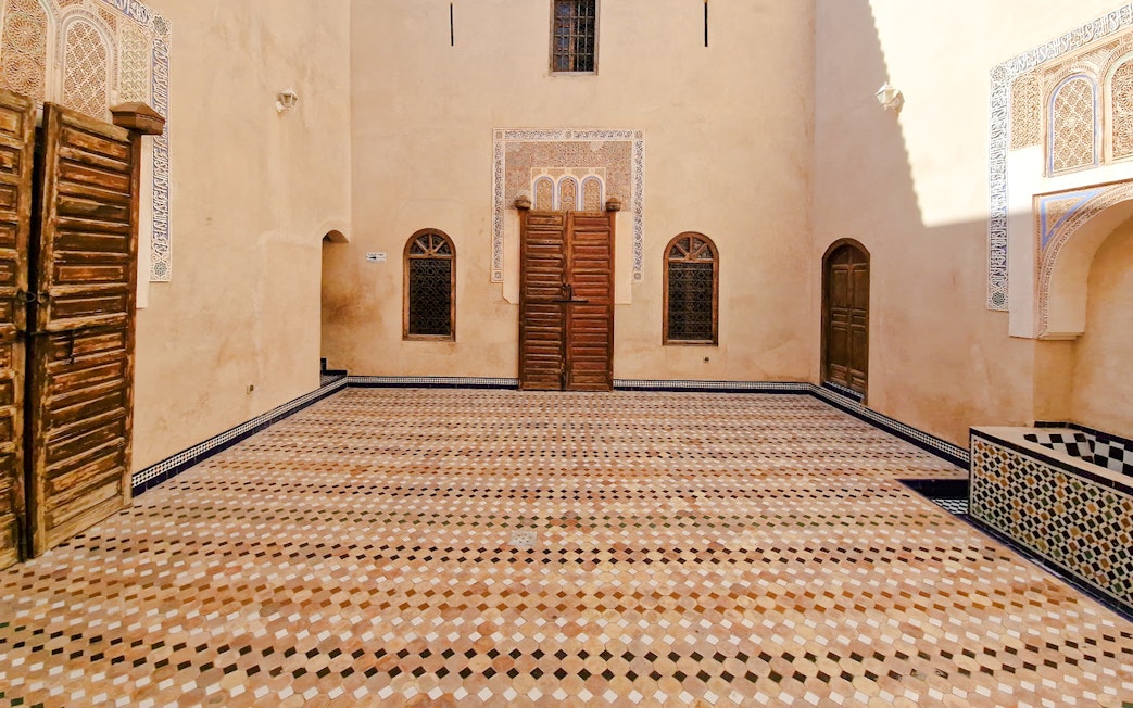 Bahia Palace courtyard with intricate tilework in Marrakech, Morocco.
