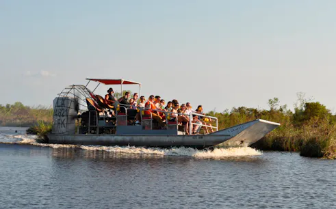 Airboat with tourists on a swamp tour near New Orleans.