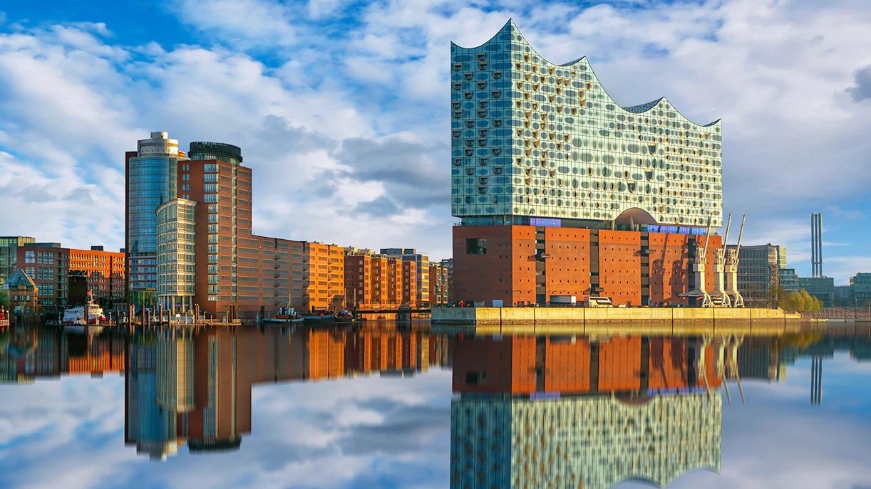 Elbphilharmonie concert hall reflecting on the river in Hamburg, Germany.