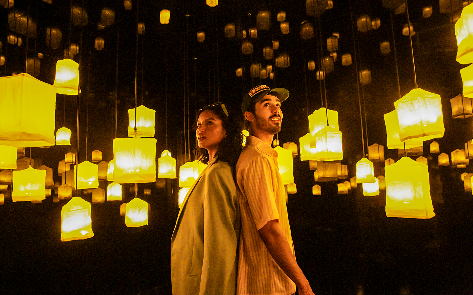 Visitors exploring interactive art installations at Ikono Madrid.