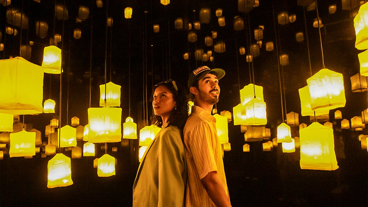 Visitors exploring interactive art installations at Ikono Madrid.