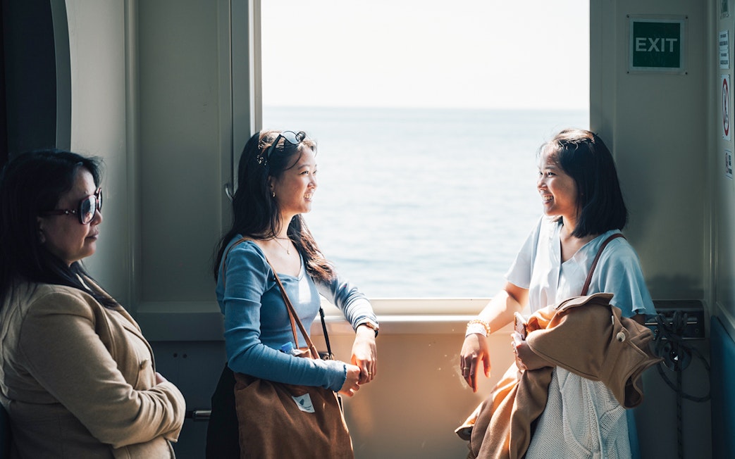 Participants enjoying a boat ride on a day trip in Cinque Terre from Florence.