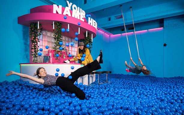 Visitors enjoying interactive exhibits at Youseum Museum Amsterdam.