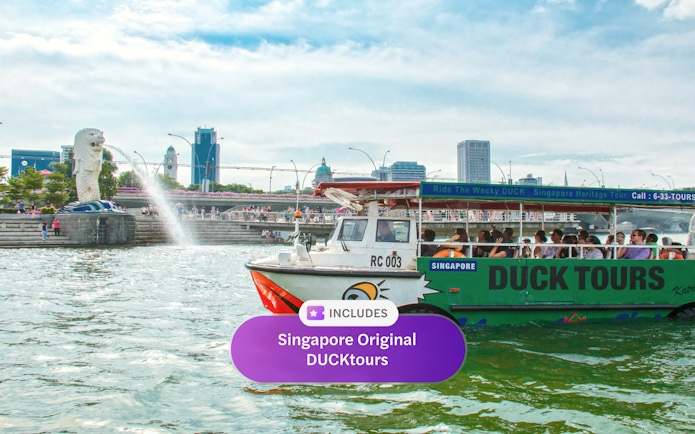DUCKtours boat near Merlion Park in Singapore with city skyline in background.