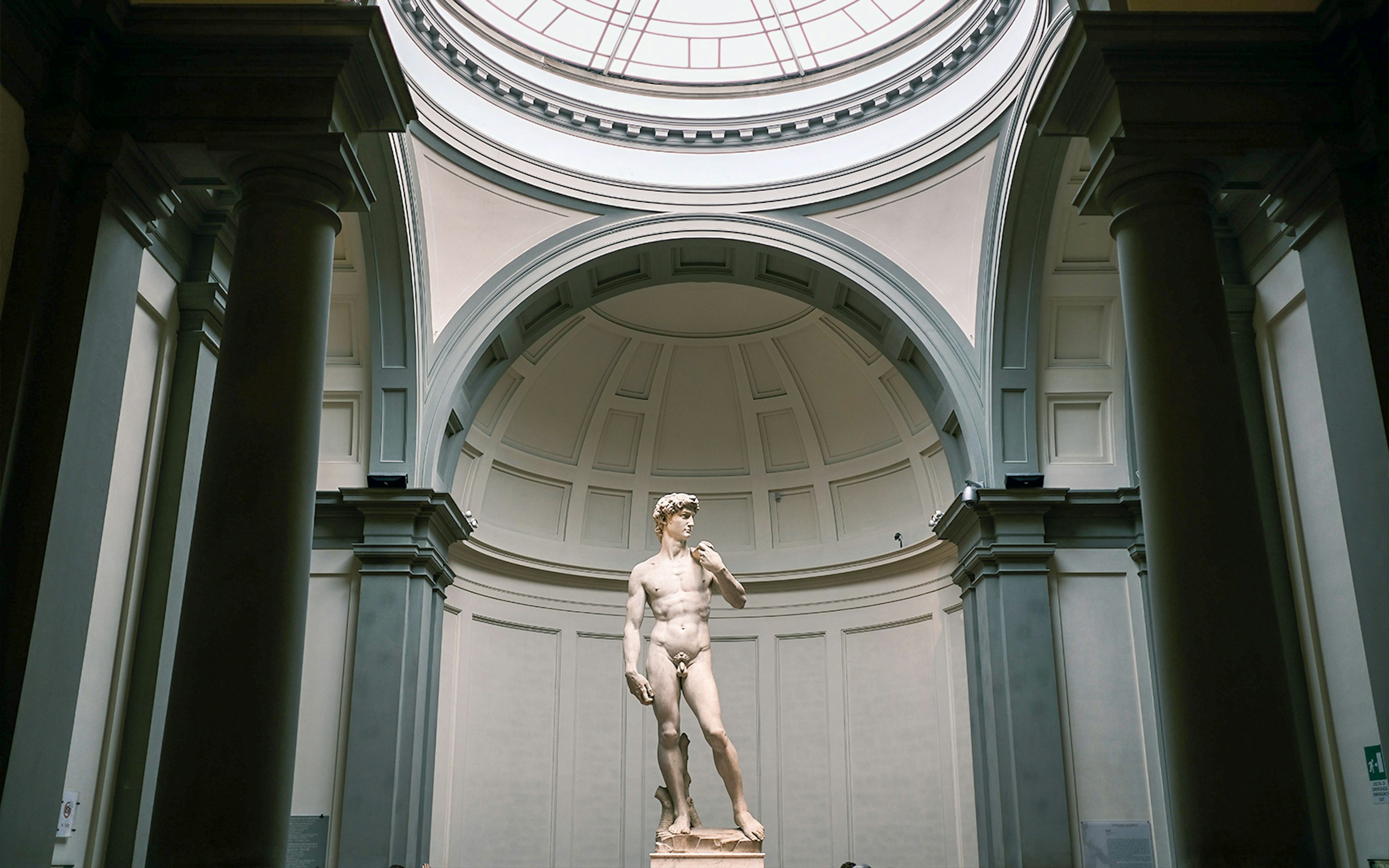 Statue of David in Florence, Italy, showcasing Renaissance art and Michelangelo's craftsmanship.