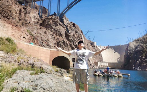 Guest enjoying the sun near Hoover Dam before rafting adventure.