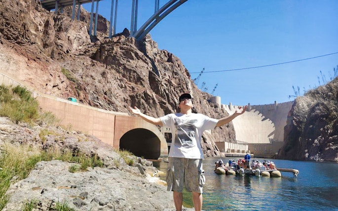 Guest enjoying the sun near Hoover Dam before rafting adventure.
