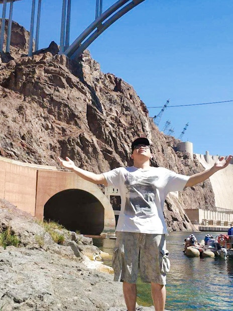 Guest enjoying the sun near Hoover Dam before rafting adventure.