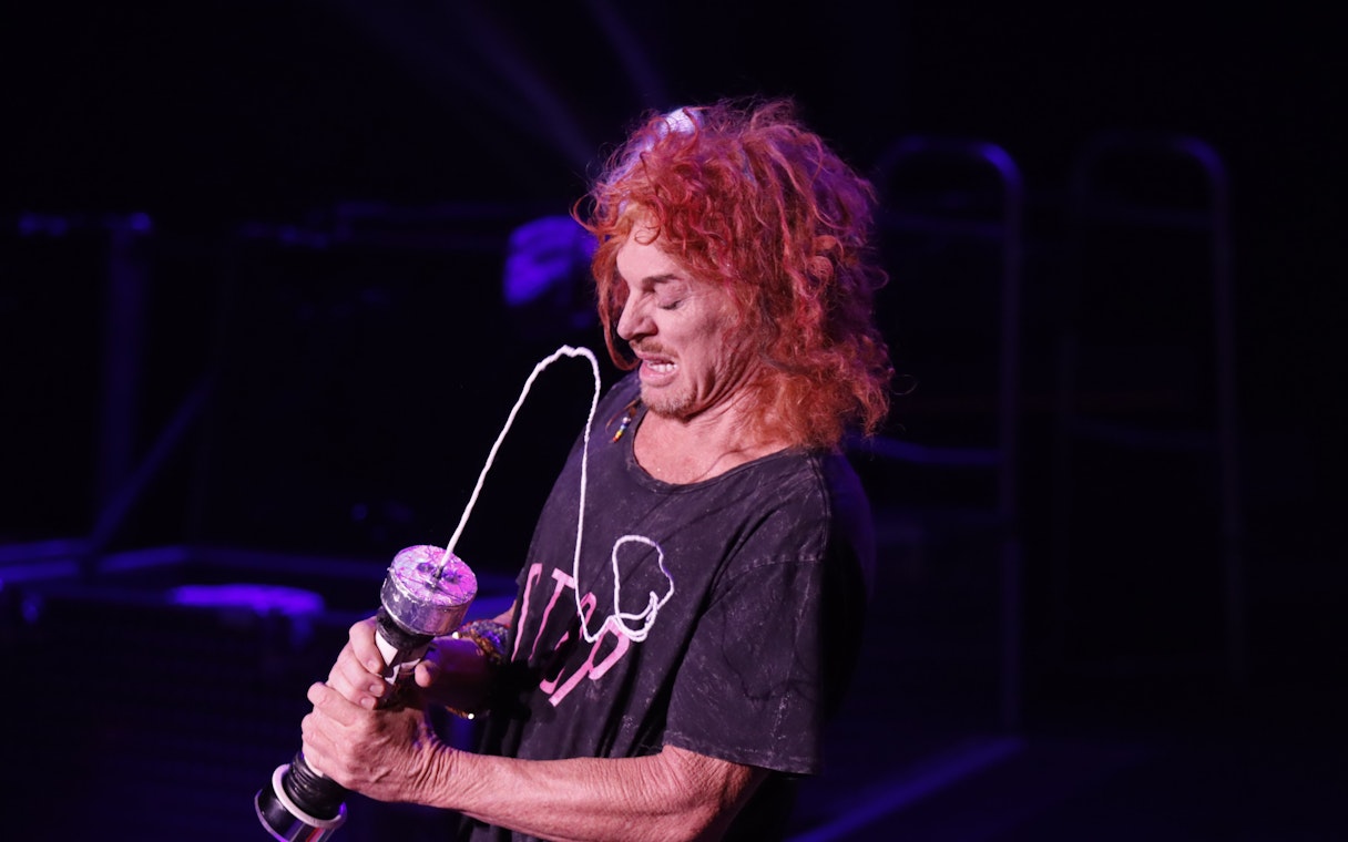 Comedian performing with a prop at Carrot Top show in Las Vegas.