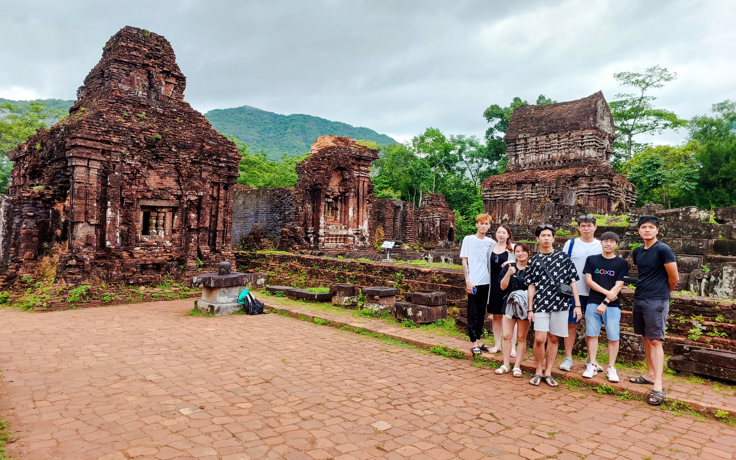 Group visiting ancient ruins at My Son Sanctuary, Vietnam.
