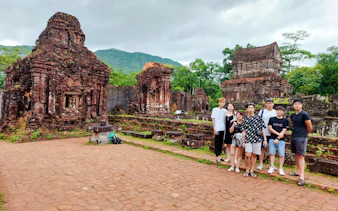 Group visiting ancient ruins at My Son Sanctuary, Vietnam.