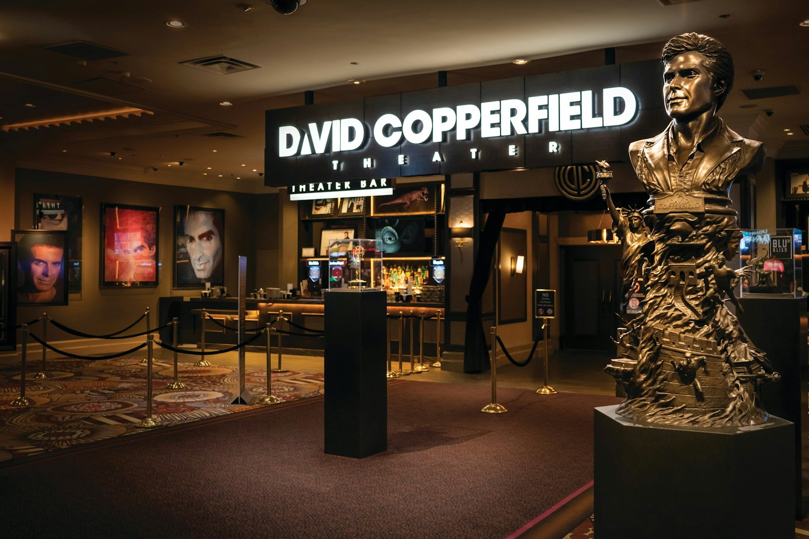 David Copperfield Theatre entrance with statue and illuminated sign.